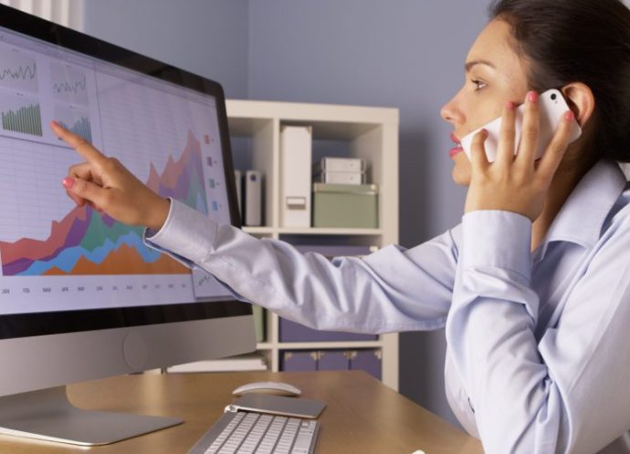 Mexican,Businesswoman,Talking,With,Colleague,On,Smartphone